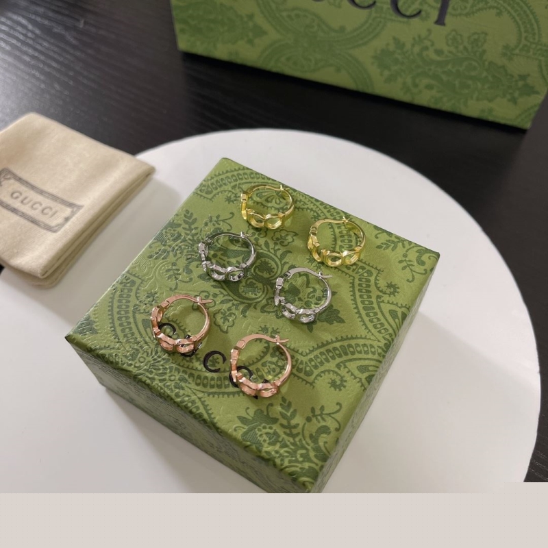 G*u*i earrings